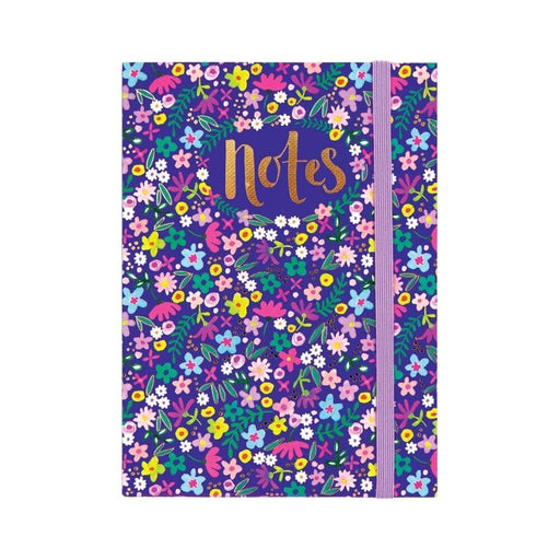 Image of a navy blue notebook with pretty floral pattern and lilac elasticated band to close the book.