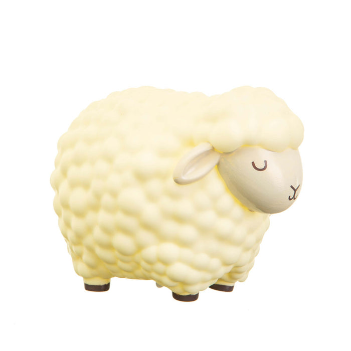 image of a childs nightlight in the shape of a cream coloured friendly lamb who has her eyes closed