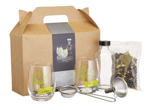 image of a barcraft gin making kit showing the gift box the set comes in together with two gin glasses with the words 'a large splash of gi, easy on the tonic' on them. next to the gin glasses are a stainless steel funnel, fine sieve, glass jar and clear bag full of gin botanicals.