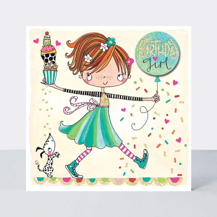  The card is illustrated with a girl holding cupcakes and a balloon, whilst there is a dog behind her. This is set on a cream coloured background. Within the balloon are the words 'Birthday girl'. It is a birthday card for a girl.