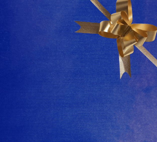 image of a square of wrapping paper, the paper is a solid dark blue kraft paper, in the corner of the gift wrap paper is a light blue gift wrapping bow