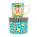 image of a predominantly white and teal coloured mug, white background with lots of teal circles and a large yellow outlined circle in the centre with text saying gorgeous at 30 in it. the mug is sat on top of a hat style gift box.