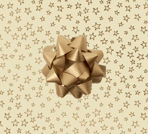 image of a square of wrapping paper, the paper is cream in colour with lots of gold stars, in the corner of the gift wrap paper is a red gift wrapping bow