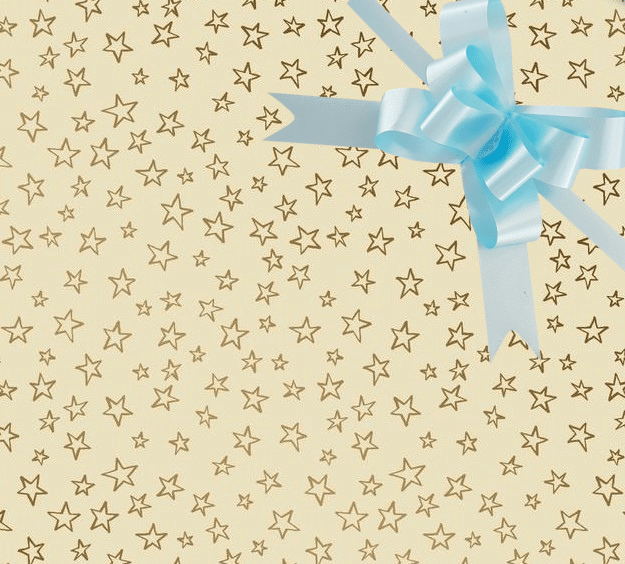 image of a square of wrapping paper, the paper is cream in colour with lots of gold stars, in the corner of the gift wrap paper is a light pink gift wrapping bow