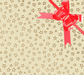 image of a square of wrapping paper, the paper is cream in colour with lots of gold stars