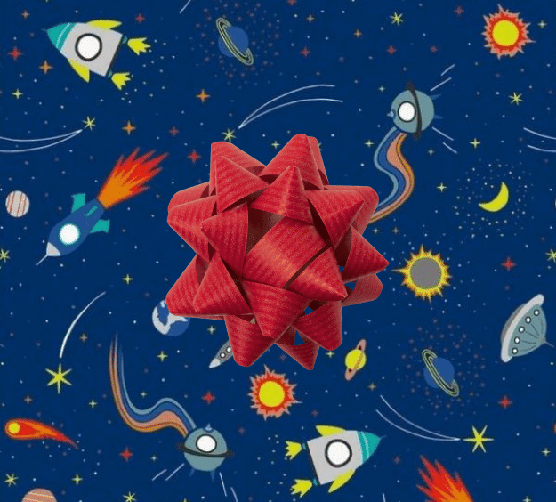 image of a square of wrapping paper, the paper is dark blue in colour and features lots of child friendly illustrated images of space objects such as planets, rockets and comets, in the centre of the gift wrap paper is a green paper gift wrapping bow