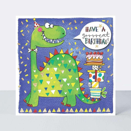  The card has a dark blue background with confetti drawn upon it. A large, green dinosaur is drawn wearing a birthday hat and holding several presents and a cake with its tail. A speech bubble is coming from the dinosaur which states 'Have a grrrreat birthday'. It is a birthday card.