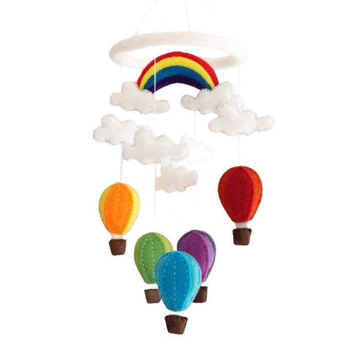 This delightful felt Hot Air Balloon Mobile by The Winding Road is a beautiful addition to your Nursery. Featuring five different coloured balloons, fluffy white clouds and a rainbow. Approximately 20" tall and 7.5" wide. Handmade from 100% natural wool. No chemicals are used during production,