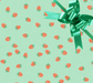 image of a square of wrapping paper, the paper has a light green almost mint background with lots of illustrated stawberries on it, in the centre of the gift wrap paper is a green paper gift wrapping bow