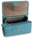 Image of a saddler lily flapover small coin purse in teal. It is made from leather