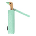 image of an umbreall whose handle is shaped like a friendly duck head, the umbrella is mint coloured