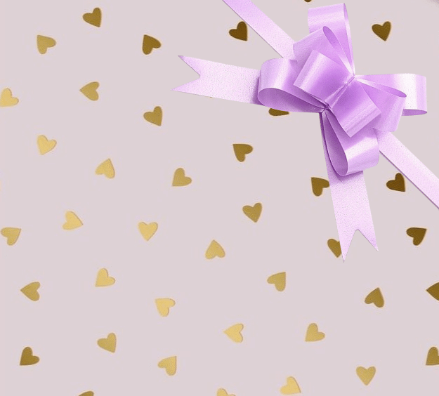 image of a square of wrapping paper, the paper has a pink background and features lots of little gold hearts all over it, in the centre of the gift wrap paper is a silver paper gift wrapping bow