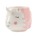 image of a mug in the shape and with the features of  a fun, colourful and cute Rainbow Unicorn. Pastel pink hair and cheeks ands white face and horn with cute eyelashes on show.