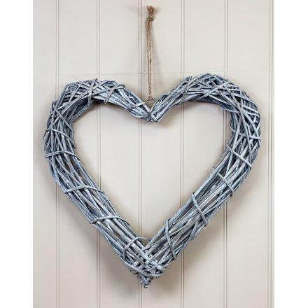 image of a rustic woven rattan heart in grey
