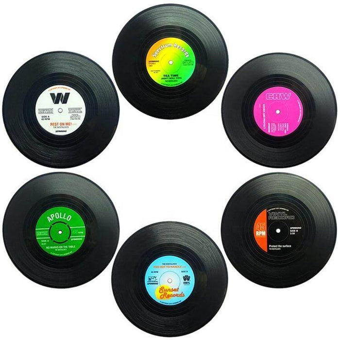 image of a set of six drinks coaster which look like mini vinyl records. Each record has a different colour label on it.