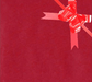 image of a square of wrapping paper, the paper is a solid dark red kraft paper, in the corner of the gift wrap paper is a bright blue gift wrapping bow