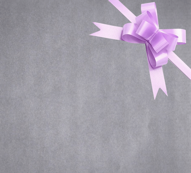 image of a square of wrapping paper, the paper is a solid silver kraft paper, in the corner of the gift wrap paper is a light pink gift wrapping bow