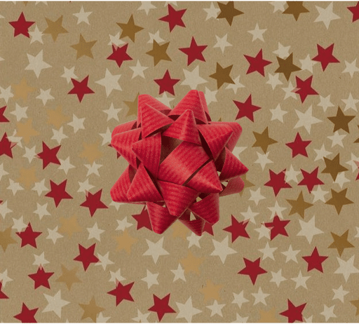 image of a square of wrapping paper, the paper has a gold background and features lots of red, gold and cream stars , in the corner of the gift wrap paper is a red gift wrapping bow