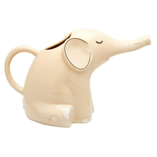 image of an elephant shaped watering can. A cute elephant in cream seen from the side with closed eye and gentle black detailing on the eye and around the ear. Shows a handle at the back, hole near the head to fill the watering can and a trunk shaped spout at the front.
