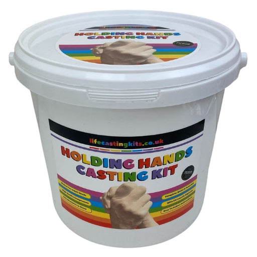A holding hands life casting kit in a bucket style with a rainbow coloured striped label design and the logo lifecastingkits.co.uk at the top and holding hands casting kit underneath