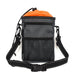 image of a black rectangular shaped dog walking bag with orange lining. The bag has a black over the shoulddr carry handle and various zips, pocjkets and compartmenst to hold equipment you might need whilst walking a dog, including a pull hole for poo bags