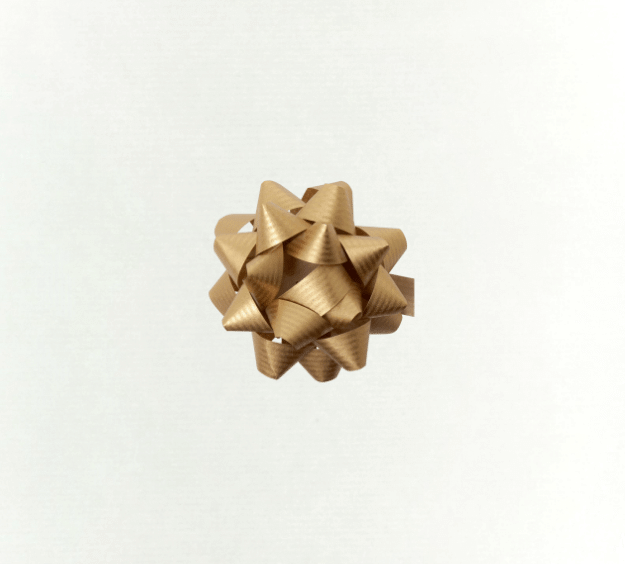 image of a square of wrapping paper, the paper is a solid white kraft paper, in the centre of the gift wrap paper is a red paper gift wrapping bow