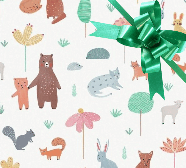 image of a square of wrapping paper, the paper has a white background with lots of child friendly illustrations of animals such as bunnies, bears and bear cubs, cats and sheeep interspered with illustrated sheep, in the corner of the gift wrap paper is a white gift wrapping bow