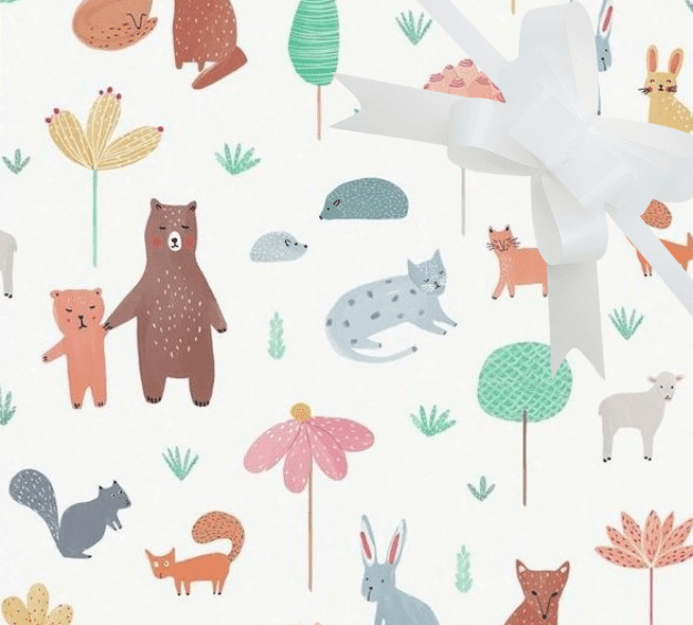 image of a square of wrapping paper, the paper has a white background with lots of child friendly illustrations of animals such as bunnies, bears and bear cubs, cats and sheeep interspered with illustrated sheep, in the corner of the gift wrap paper is a light blue gift wrapping bow