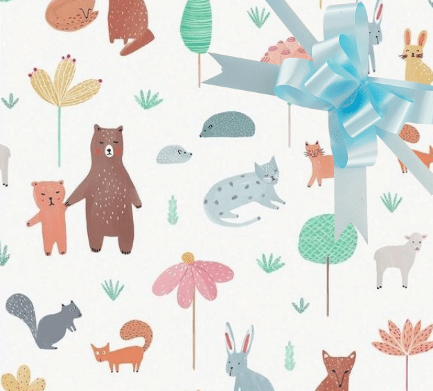image of a square of wrapping paper, the paper has a white background with lots of child friendly illustrations of animals such as bunnies, bears and bear cubs, cats and sheeep interspered with illustrated sheep, in the centre of the gift wrap paper is a silver paper gift wrapping bow