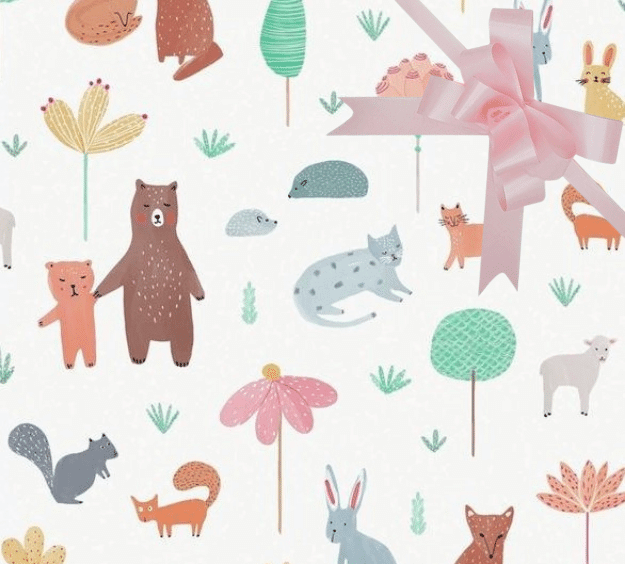 image of a square of wrapping paper, the paper has a white background with lots of child friendly illustrations of animals such as bunnies, bears and bear cubs, cats and sheeep interspered with illustrated sheep, in the corner of the gift wrap paper is a gold gift wrapping bow