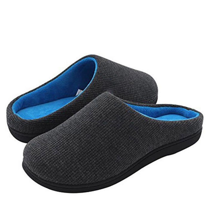 Image of a pair of mens memory foam slippers in two tone grey and blue. with a charcoal grey waffle knit upper, a bright blue cotton fleece inner and a black rubber sole.