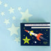 image of various sizes of glow in the dark stars in a 17cm navy blue box with a colourful rocket on the front.