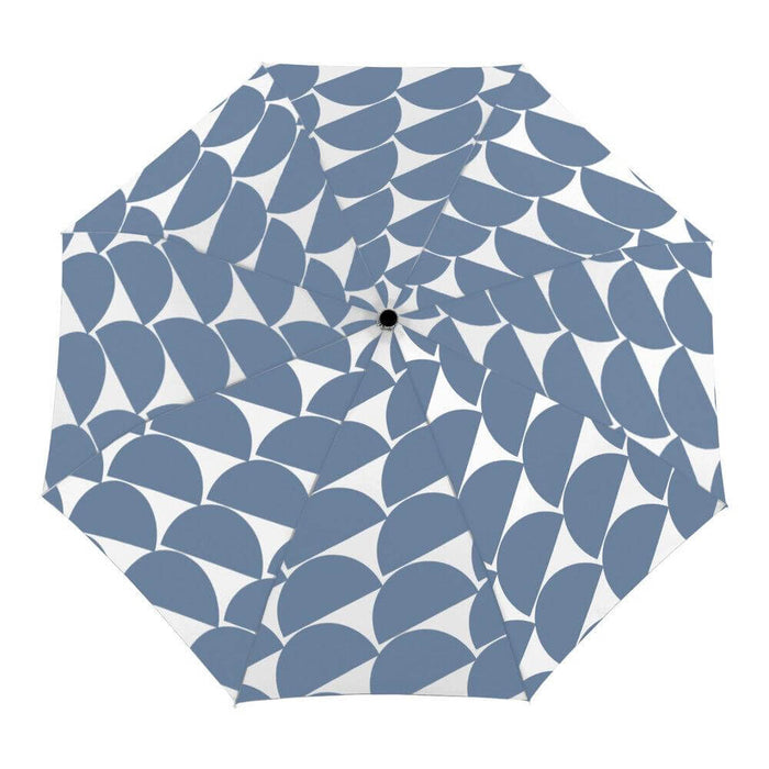 top down image of an open denim blue umbrella