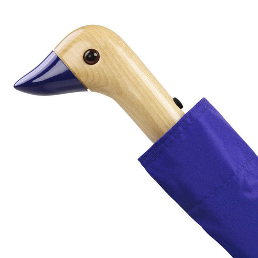 image of an umbreall whose handle is shaped like a friendly duck head, the umbrella is blue