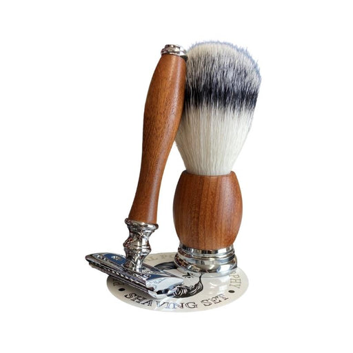 image of a traditional double edged shaving razor and shaving brush. the razor and brush have chrome turned detailing and red pear wooden handles. the image is of a practical pogonotrophy shaving razor and brush set.